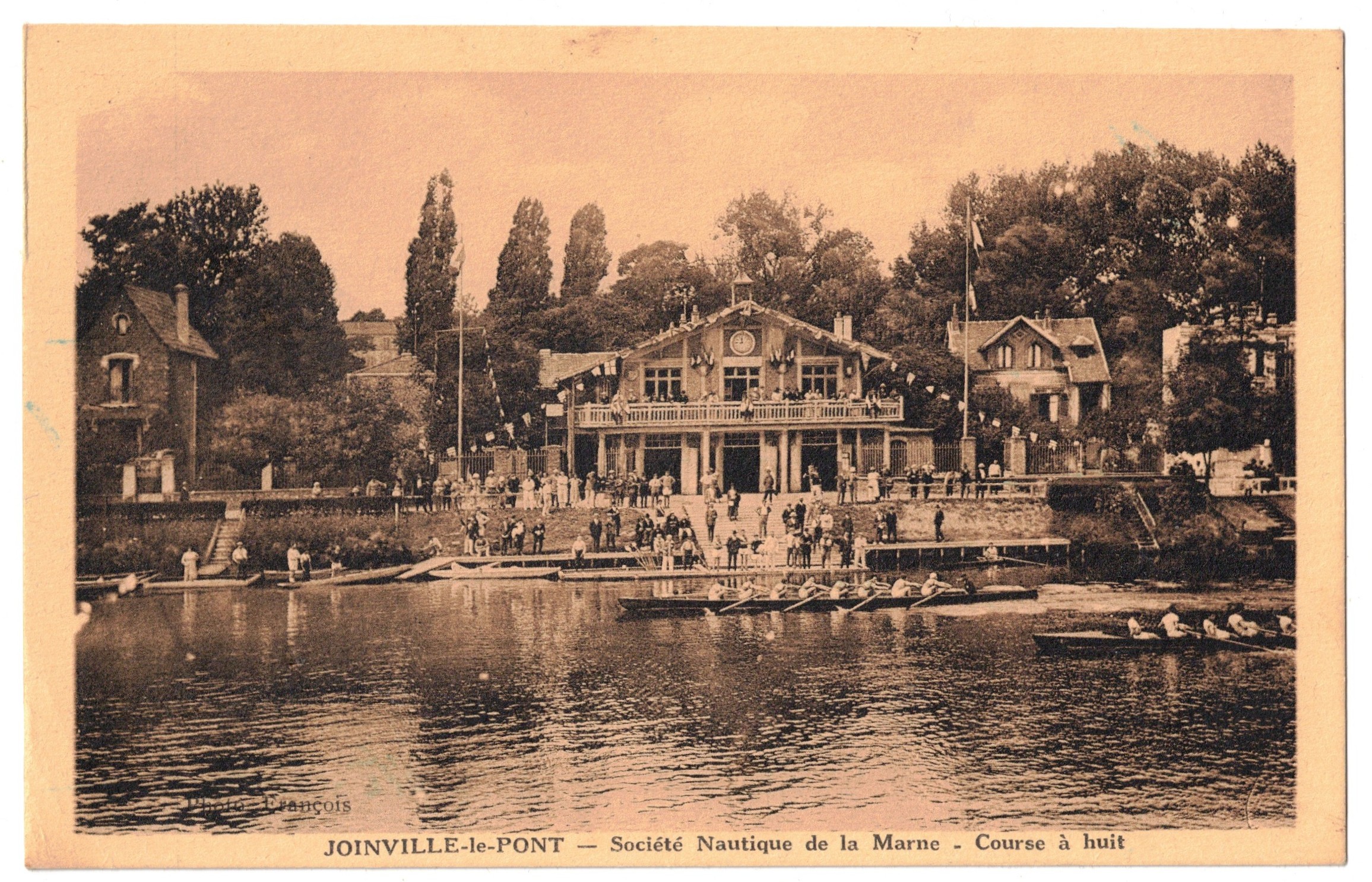 PC FRA Joinville le Pont Société Nautique de la Marne boathouse with M8 race in foreground